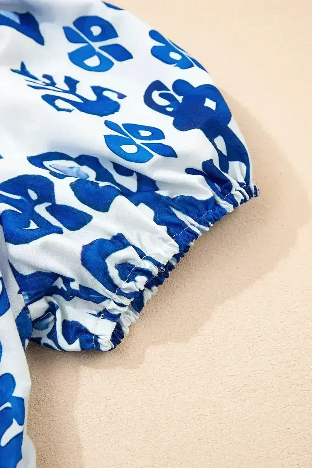 Blue Floral Ruffle Hem Pop of Color Neckline Dress - Femstylo