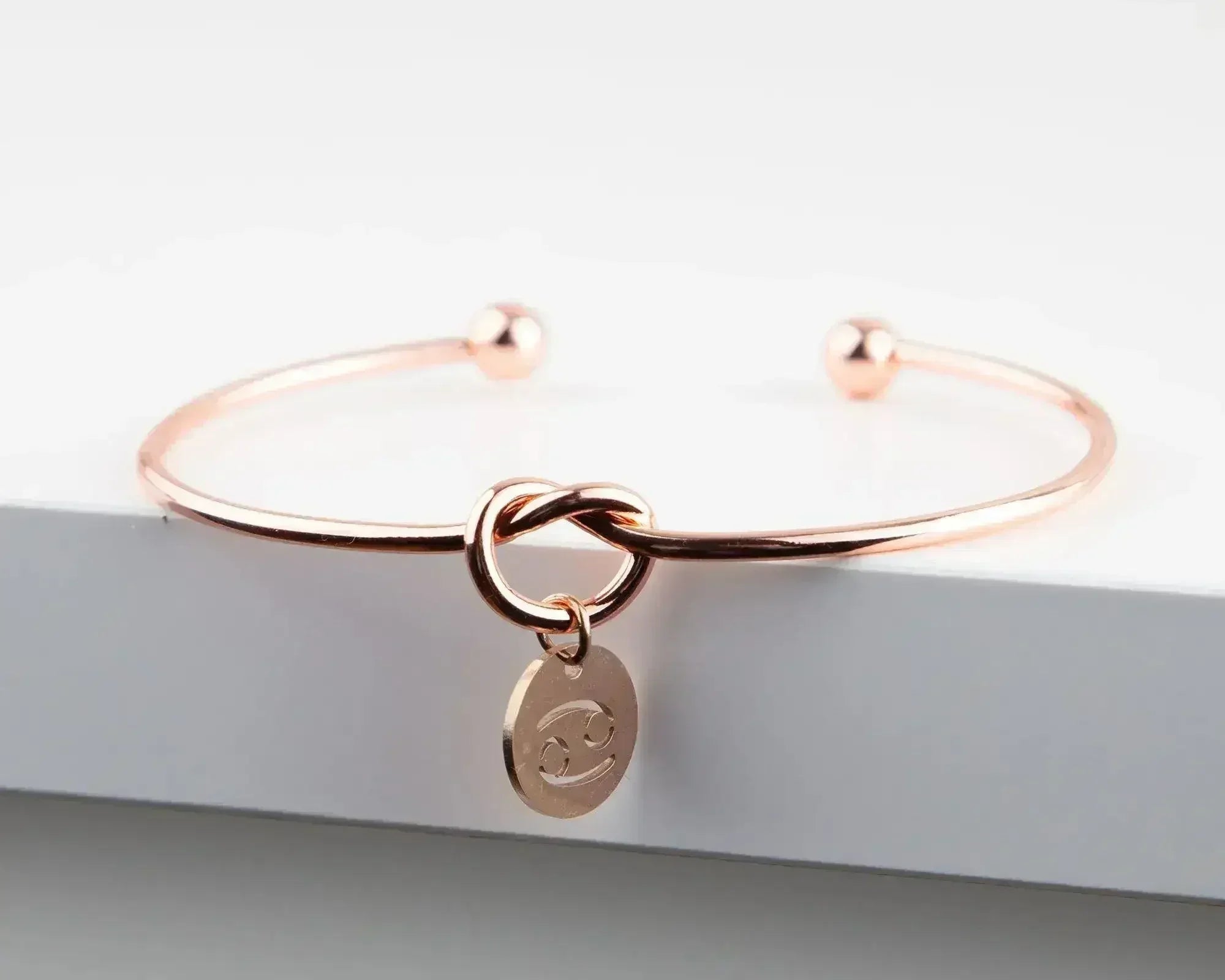 Dainty Knot Bracelet, Rose Gold Plated Wire Knot Bangle with Zodiac - Femstylo