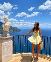 YENKYE Sexy Elegant Women Hollow Out Embroidery Yellow Sling Mini Dress Low Waist Lace Up Bandage Party Dresses Birthday Robe