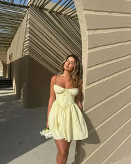 YENKYE Sexy Elegant Women Hollow Out Embroidery Yellow Sling Mini Dress Low Waist Lace Up Bandage Party Dresses Birthday Robe