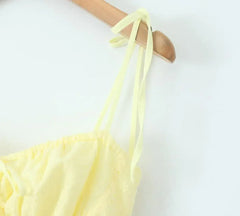 YENKYE Sexy Elegant Women Hollow Out Embroidery Yellow Sling Mini Dress Low Waist Lace Up Bandage Party Dresses Birthday Robe