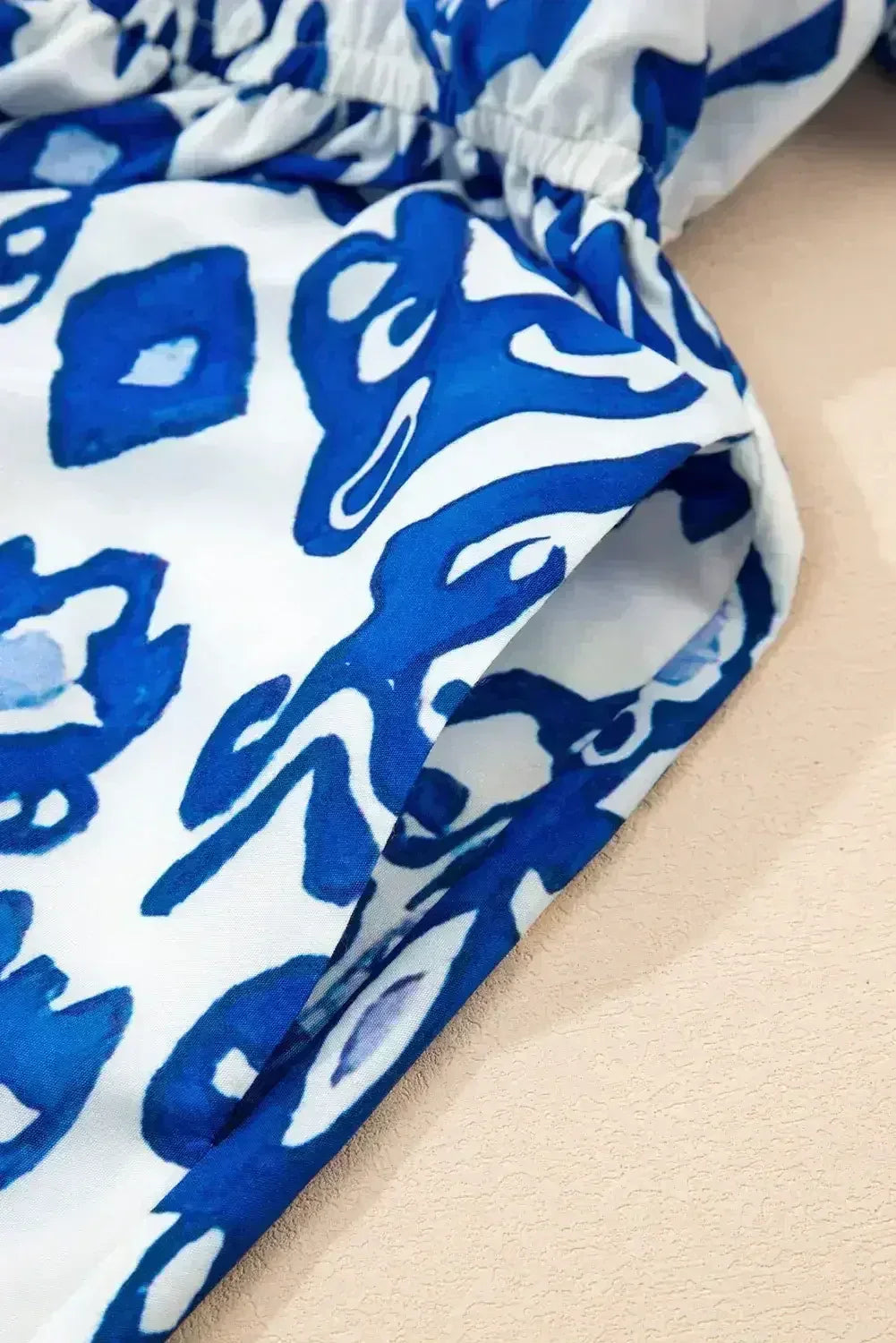 Blue Floral Ruffle Hem Pop of Color Neckline Dress - Femstylo